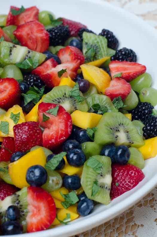 Fruit Salad with Sweet Lime Dressing in a white bowl.