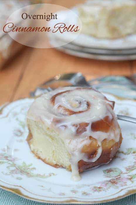 Overnight Cinnamon Rolls on a plate with a fork.