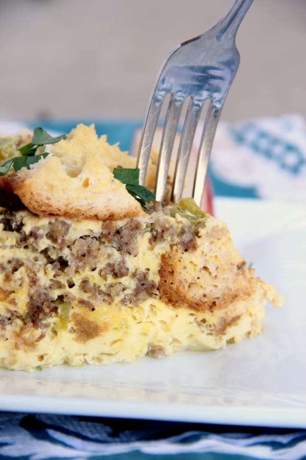 Slow Cooker Egg & Sausage Casserole on a plate with a fork.