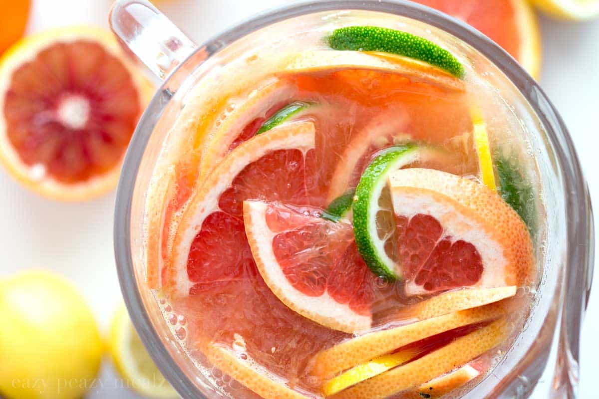Citrus Sangria (Non-Alcoholic) in a glass with fresh fruit.