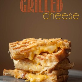 This crunchy and gooey triple threat grilled cheese uses gouda and sharp cheddar melted in between two parmesan encrusted grilled pieces of sourdough.