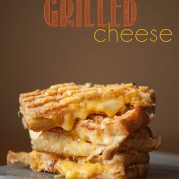 This crunchy and gooey triple threat grilled cheese uses gouda and sharp cheddar melted in between two parmesan encrusted grilled pieces of sourdough.