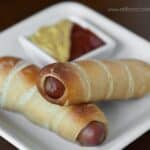 Pretzel Wrapped Hot Dogs are surprisingly easy to make and a fun alternative to the boring bun. They can be made ahead and enjoyed while camping too!
