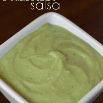 square white bowl of homemade avocado tomatillo salsa