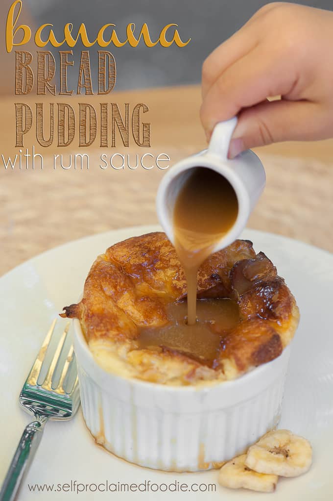 pouring rum sauce on homemade bread pudding