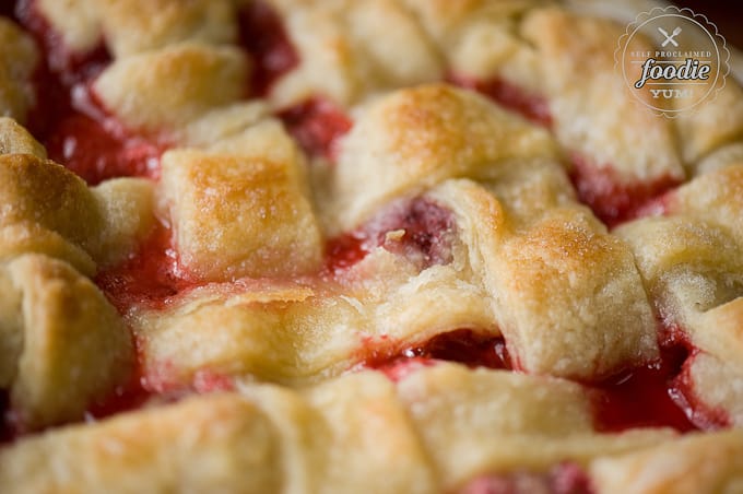 Lattice top of a homemade strawberry rhubarb pie