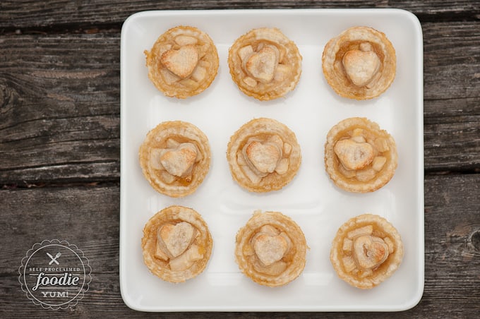 looking down at a platter of mini pear tarts