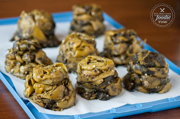 piles of roasted green chile on parchment paper