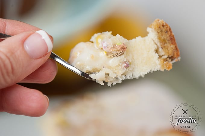 a bite of pistachio lemon cake on fork