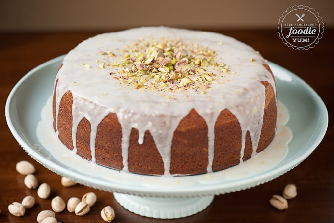 iced pistachio lemon cake on platter