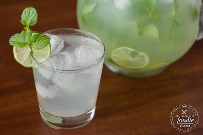 glass of ice water with lime and mint
