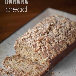 a loaf of pumpkin banana bread with walnut streusel topping