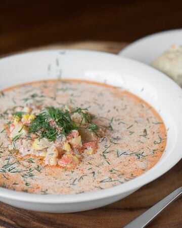 Enjoy a hearty and tasty bowl of homemade Salmon Chowder made with fresh corn, potato, lots of fresh dill, and a touch of cream. Delicious!