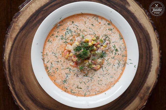looking down at a bowl of homemade creamy salmon chowder with corn