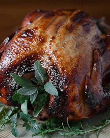 Damn Good Roast Turkey will impress your Thanksgiving guests! Oven roasted turkey made unbelievably moist and flavorful from apple cider brine and herbs.