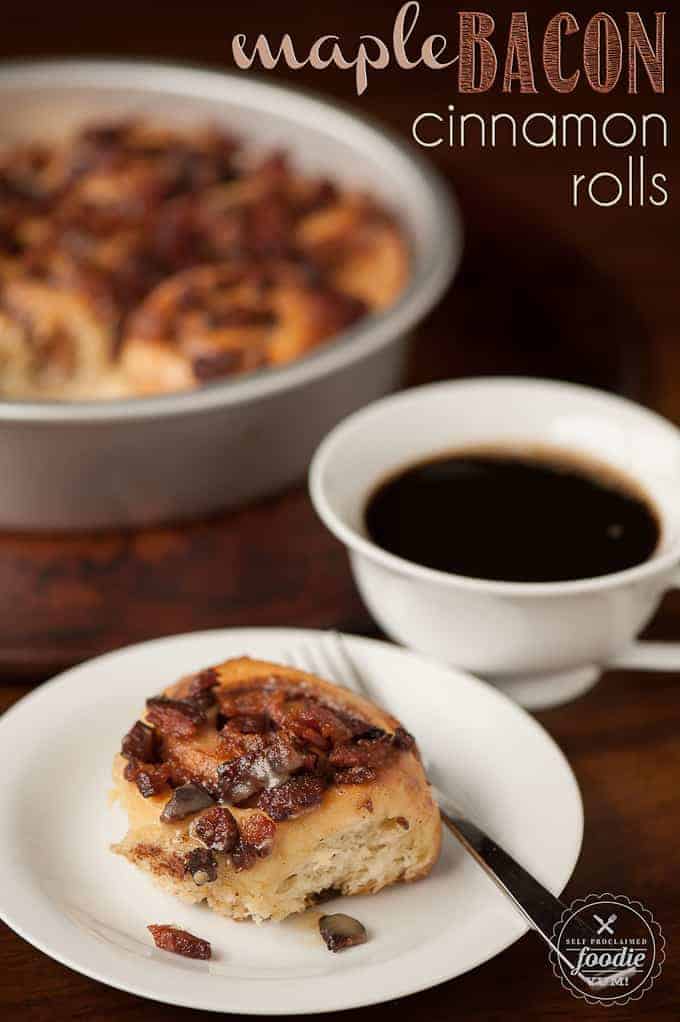 A plate bacon cinnamon roll with a cup of coffee