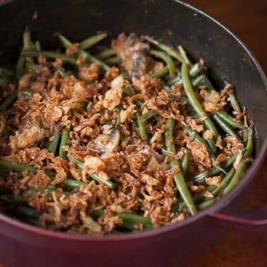 This Perfect Green Bean Casserole is made with fresh Hericot Vert green beans, fresh and dried mushrooms, and is topped with crispy fried onions.