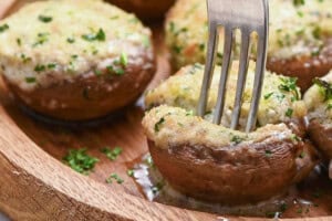boursin stuffed mushrooms with fork.