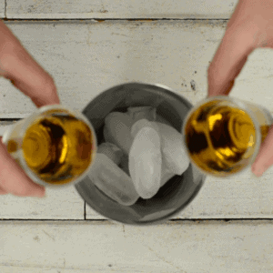 making pomegranate whiskey sour.