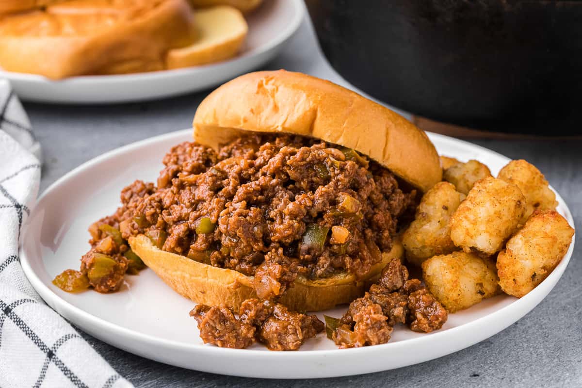 Homemade sloppy joes served on a bun with tater tots.