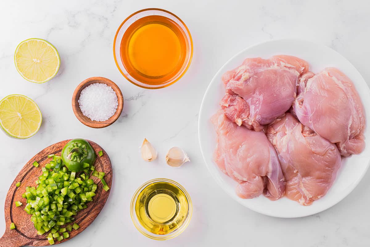 ingredients to make grilled chicken thighs with a jalapeno lime honey marinade.