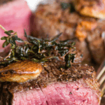 Recipe for perfect filet mignon that is pan seared with butter, garlic, and herbs and then finished in the oven.