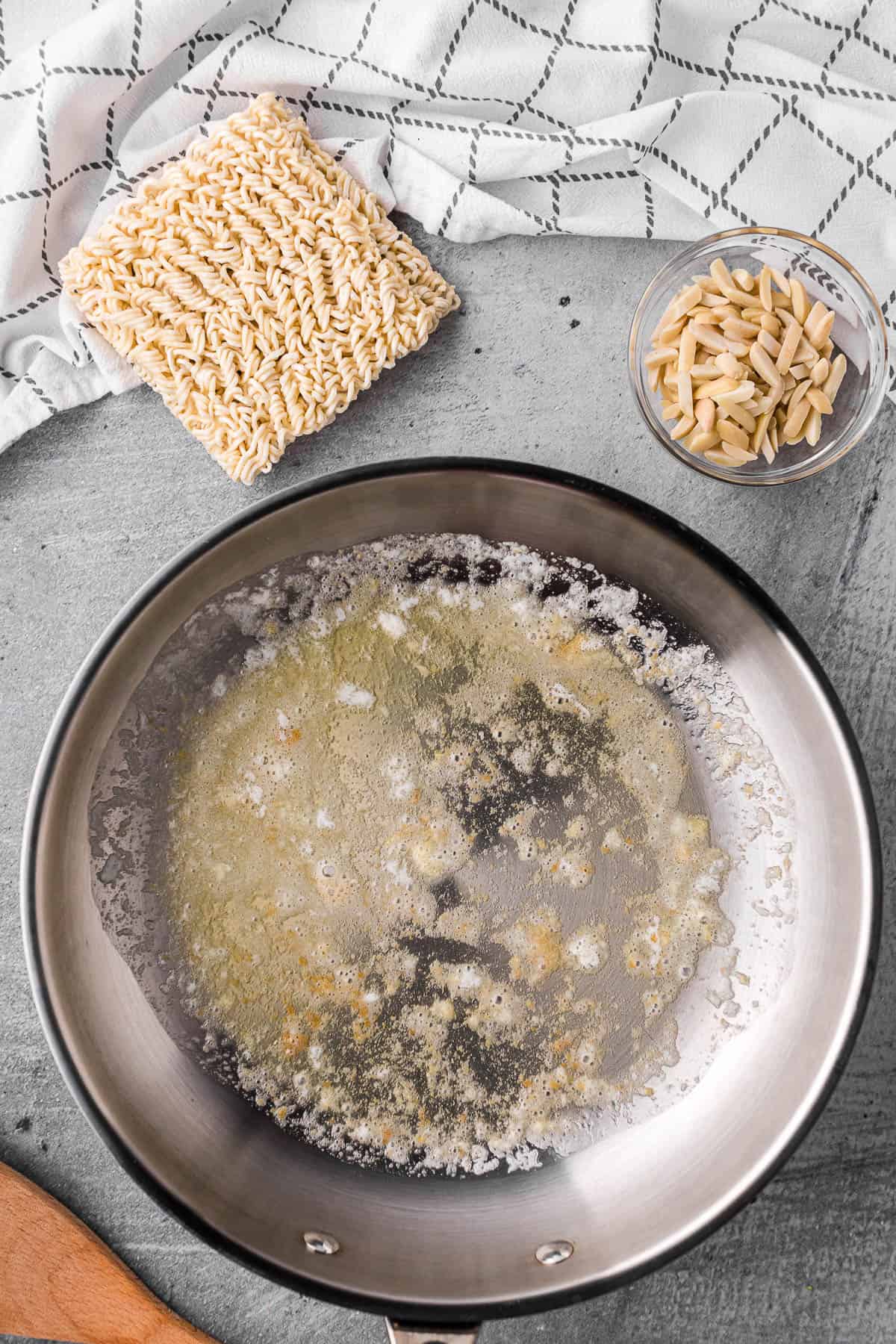 melted butter with ramen noodles and almonds.