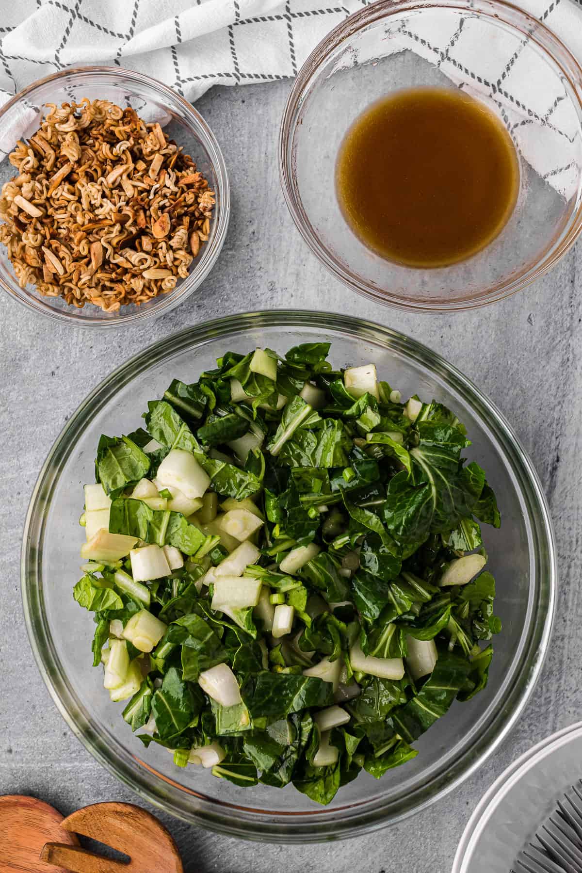 bowl of homemade bok choy salad with a crunchy ramen almond topping and dressing.