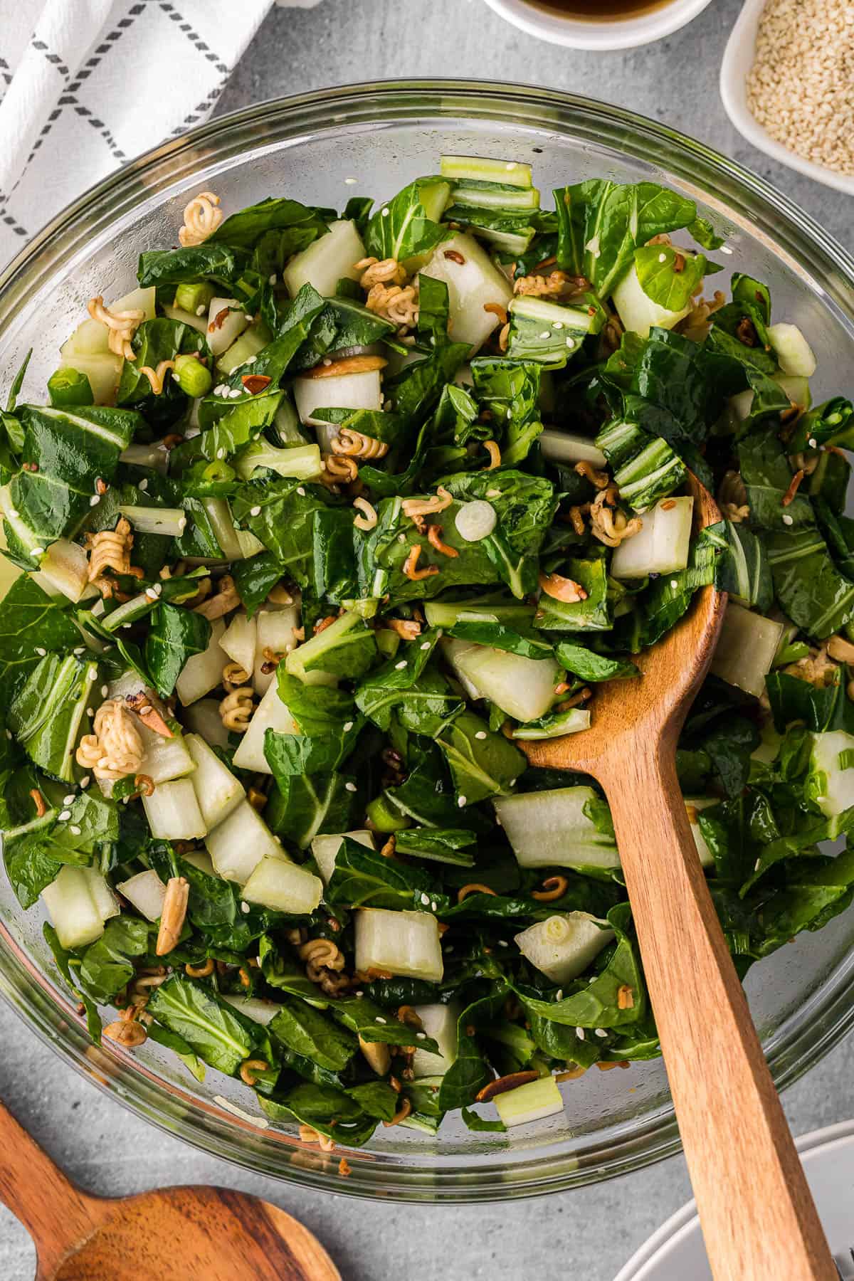 bowl of homemade bok choy salad with a crunchy ramen almond topping.