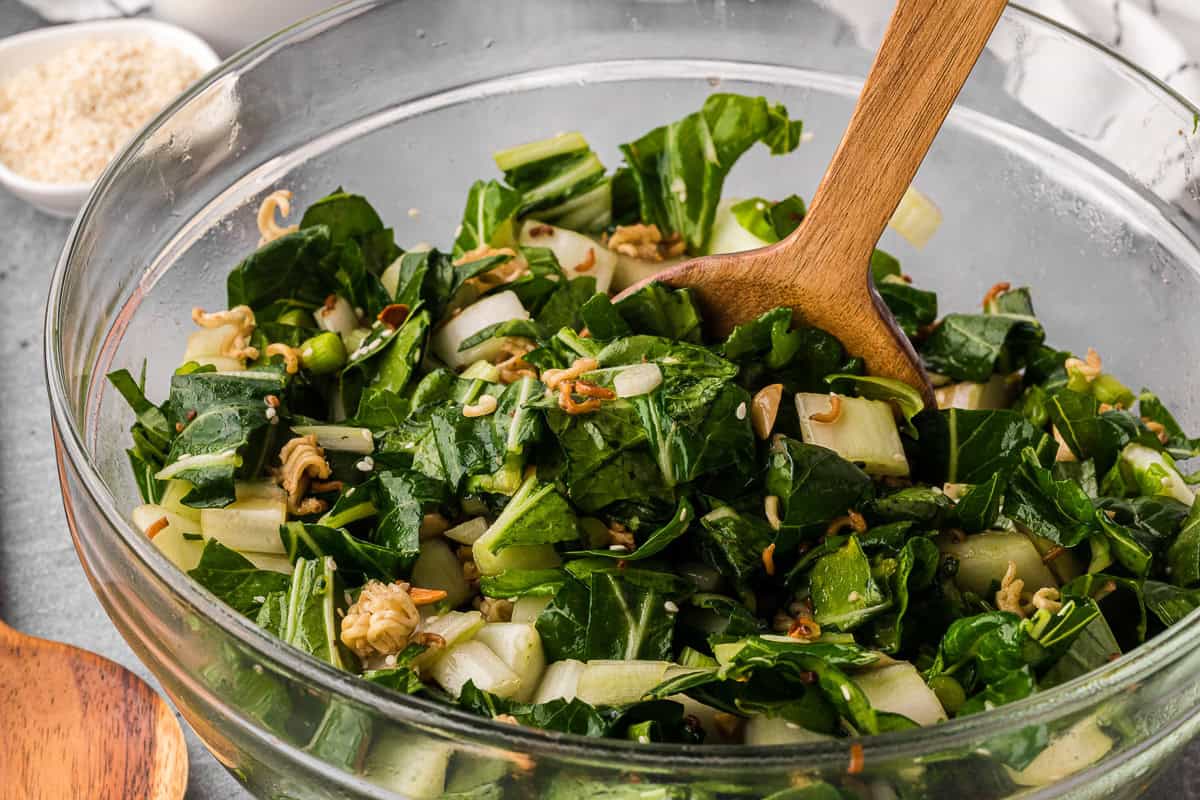 bowl of homemade bok choy salad with a crunchy ramen almond topping.