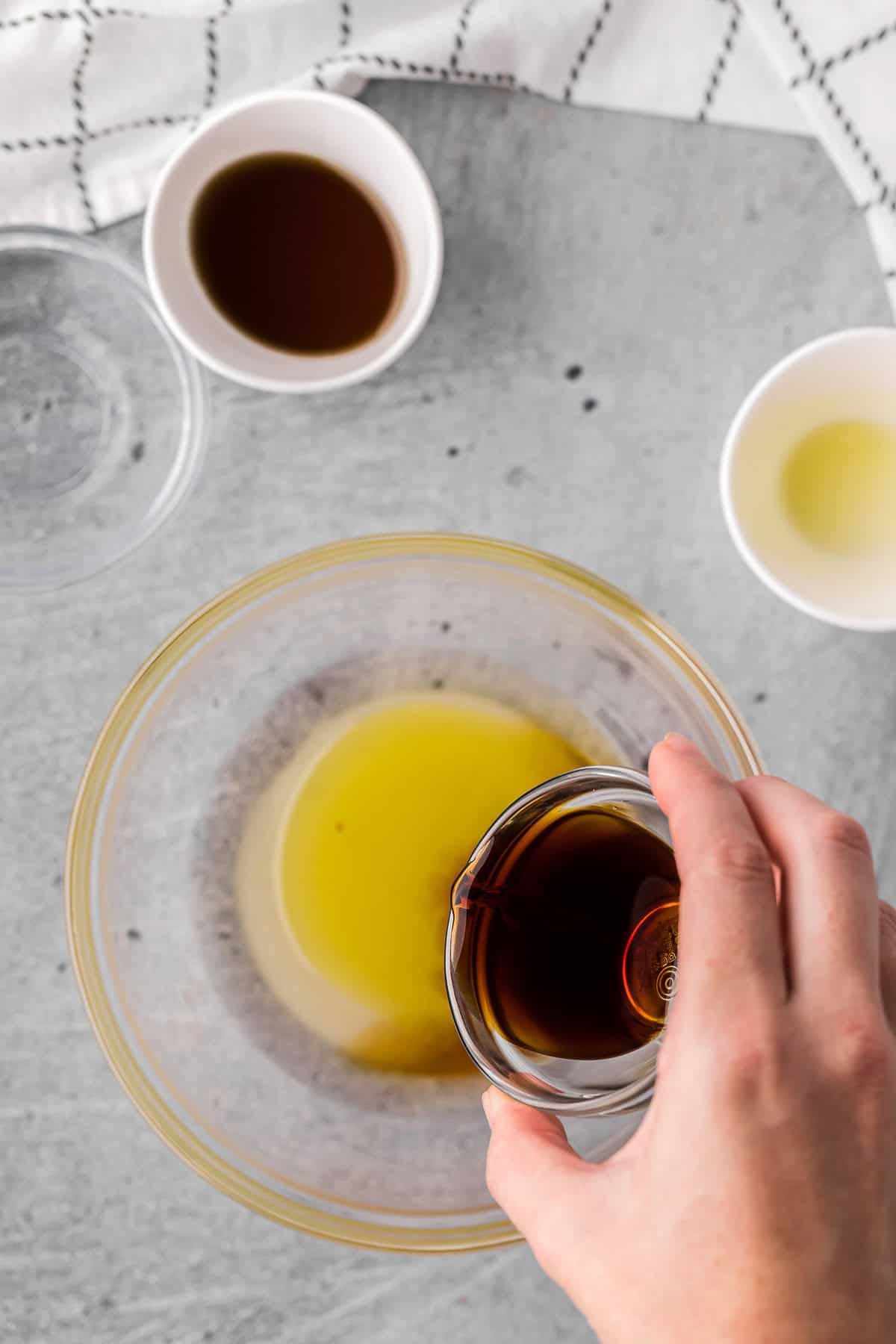 mixing ingredients to make Asian salad dressing.