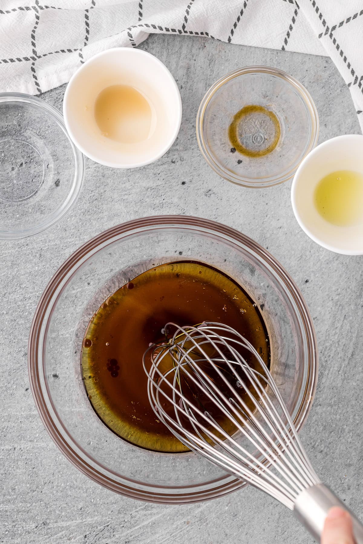 mixing ingredients to make Asian salad dressing.