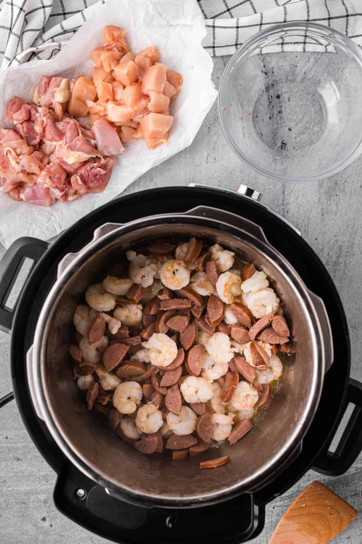 Cooking sausage and shrimp in Instant Pot for jambalaya recipe.
