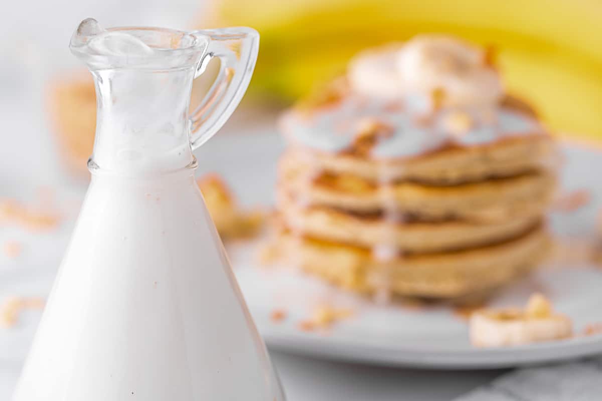 Simple coconut milk syrup recipe and a stack of banana pancakes.
