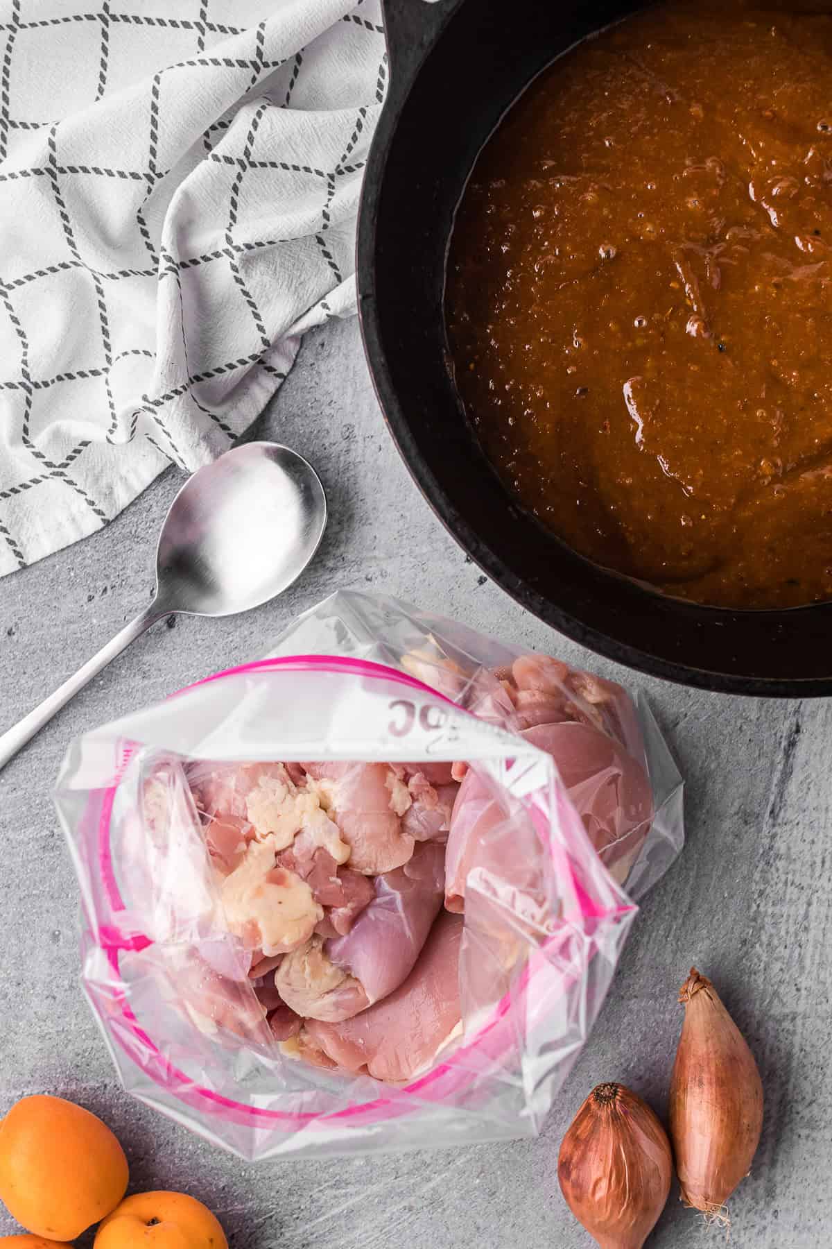 marinating boneless skinless chicken thighs in homemade fresh apricot glaze.