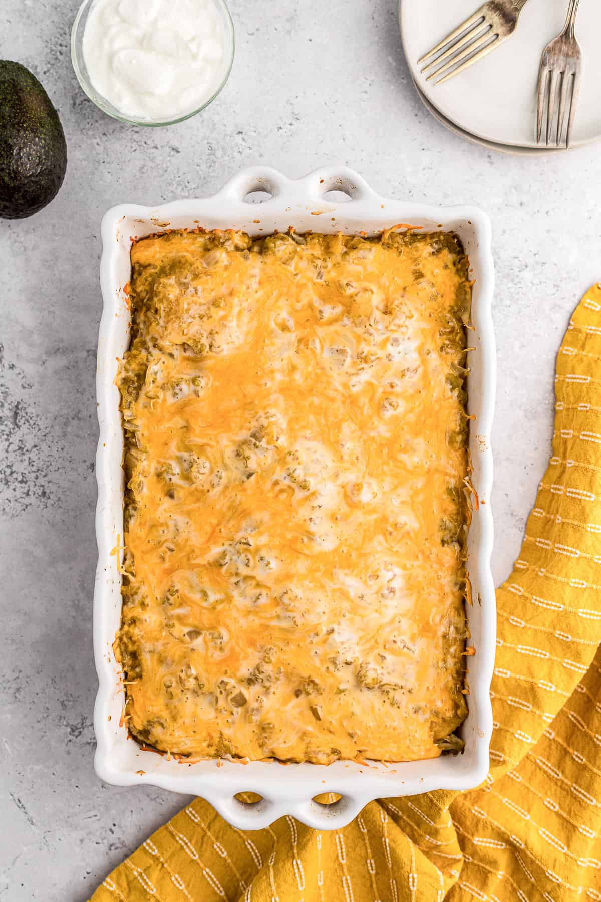 Chicken verde enchilada casserole in baking dish.