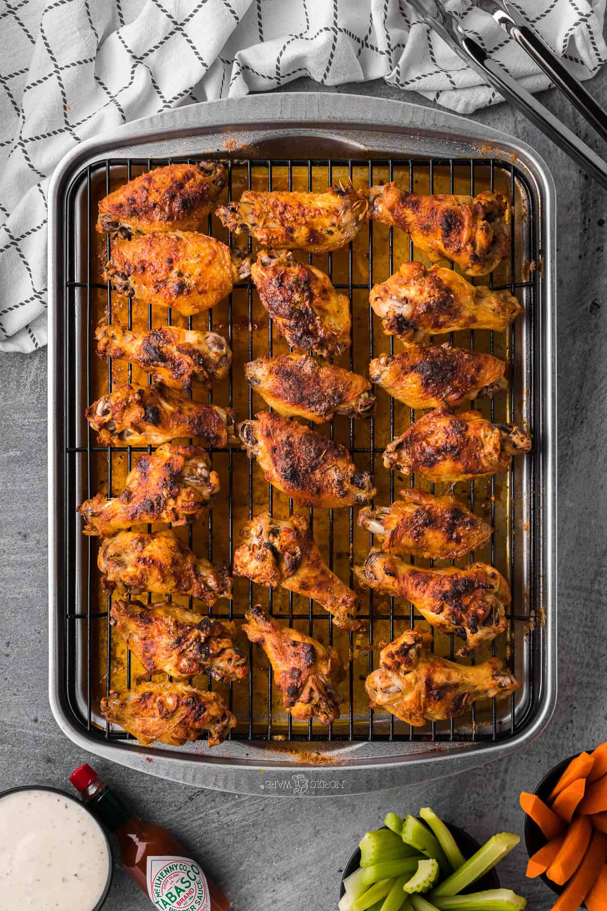 baked ranch chicken wings on baking sheet with rack.