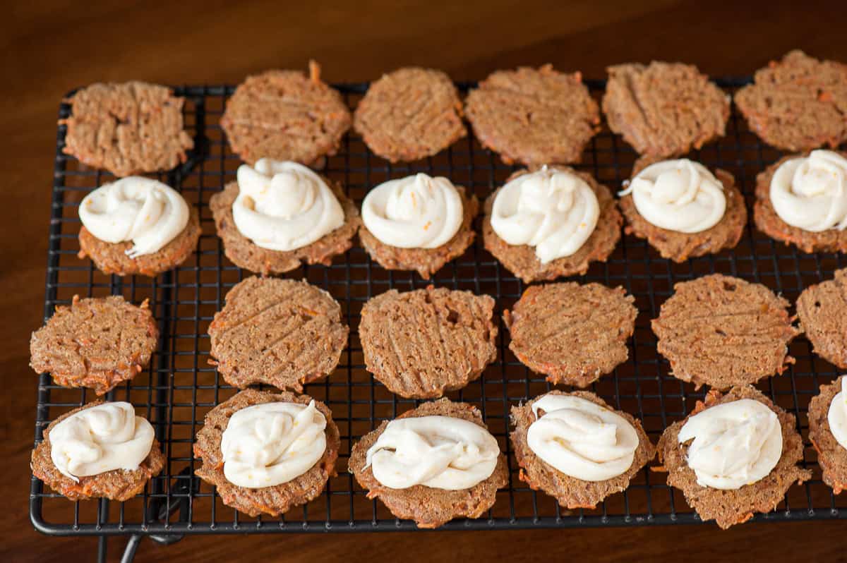 making carrot cake sandwich cookies with cream cheese frosting.