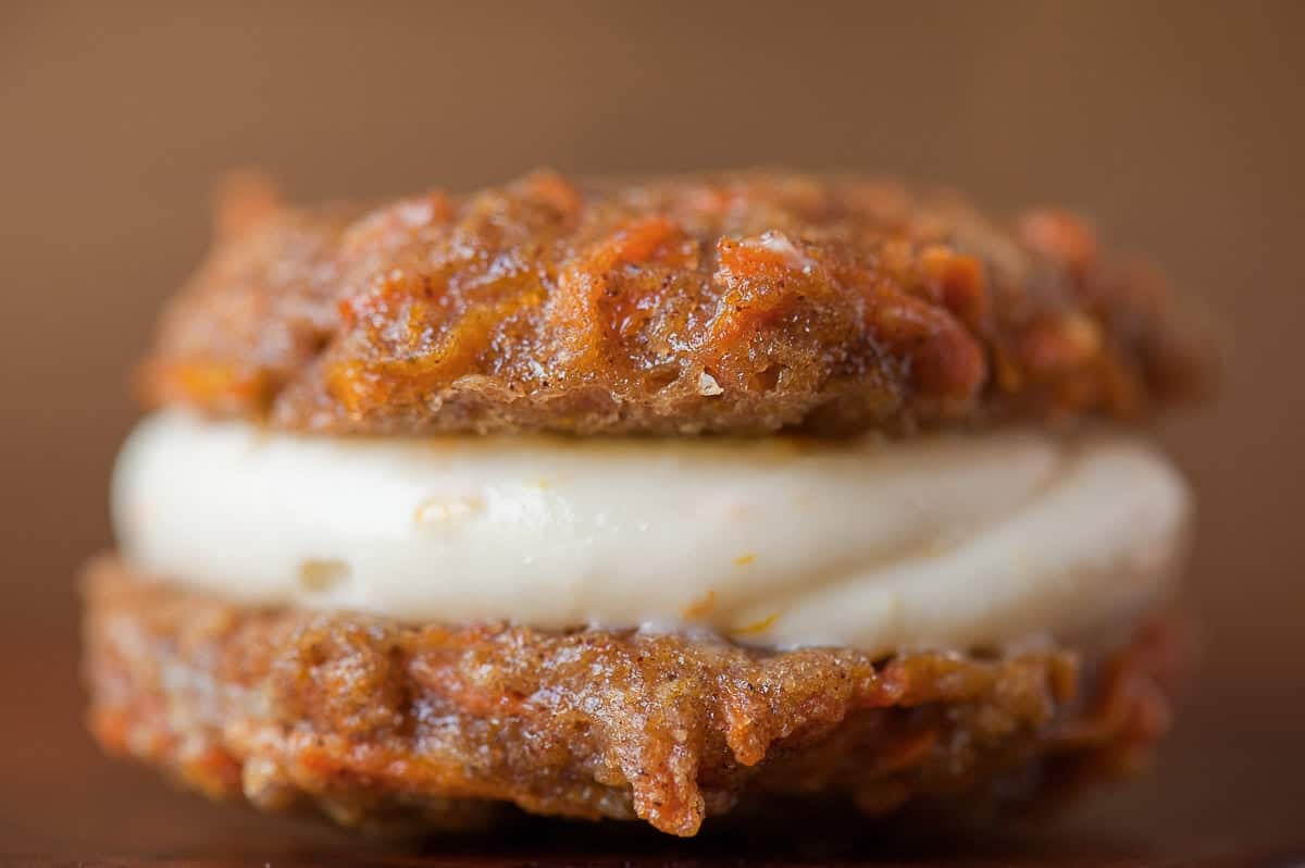 carrot cake sandwich cookies with cream cheese frosting.