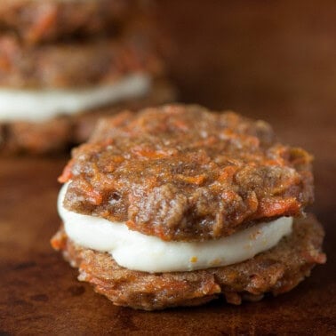 carrot cake sandwich cookies with cream cheese frosting.