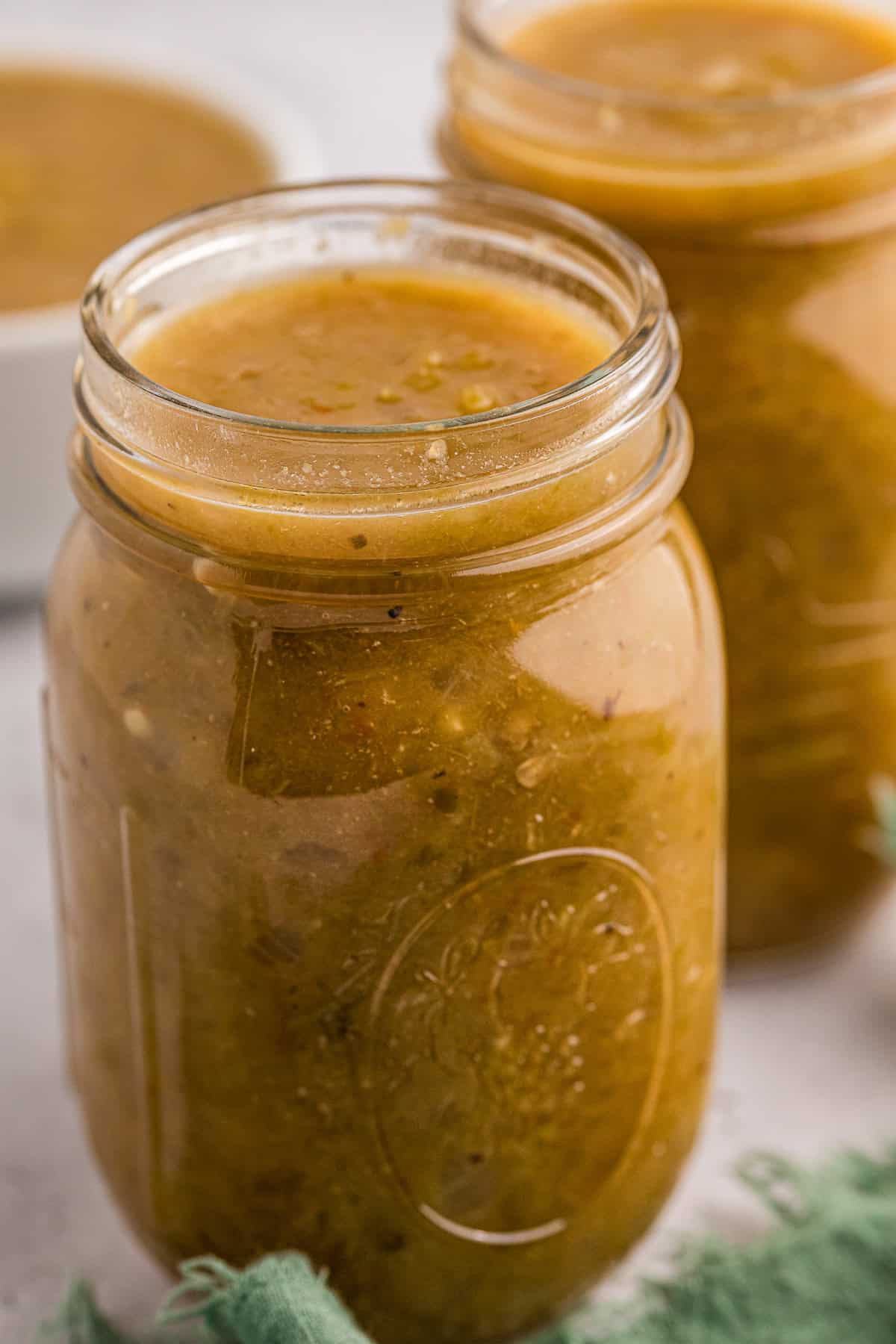 mason jar filled with homemade green enchilada sauce.