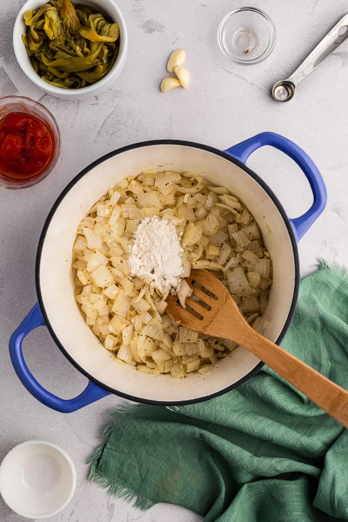 browning onions and adding flour to make homemade green enchilada sauce recipe.