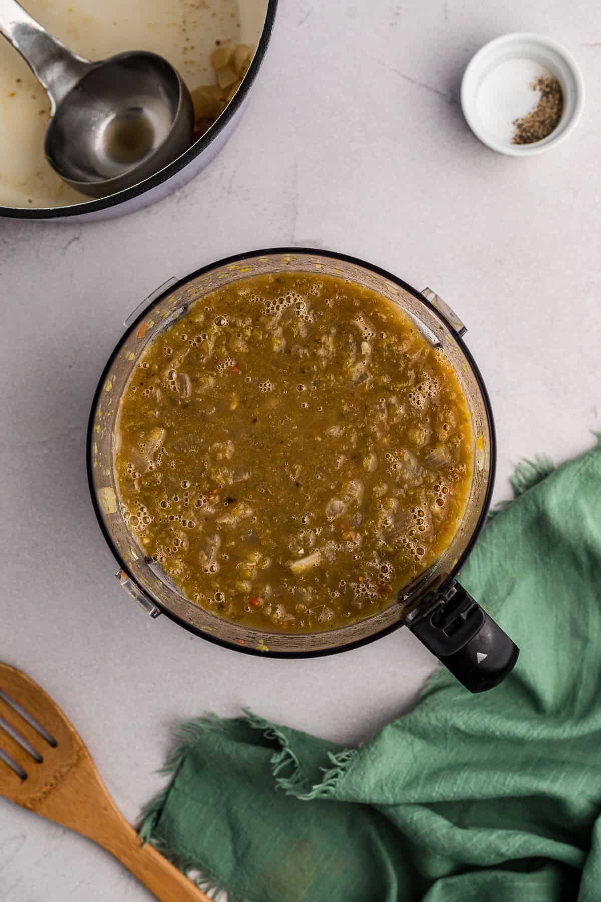 homemade homemade green enchilada sauce added to food processor to make smooth.