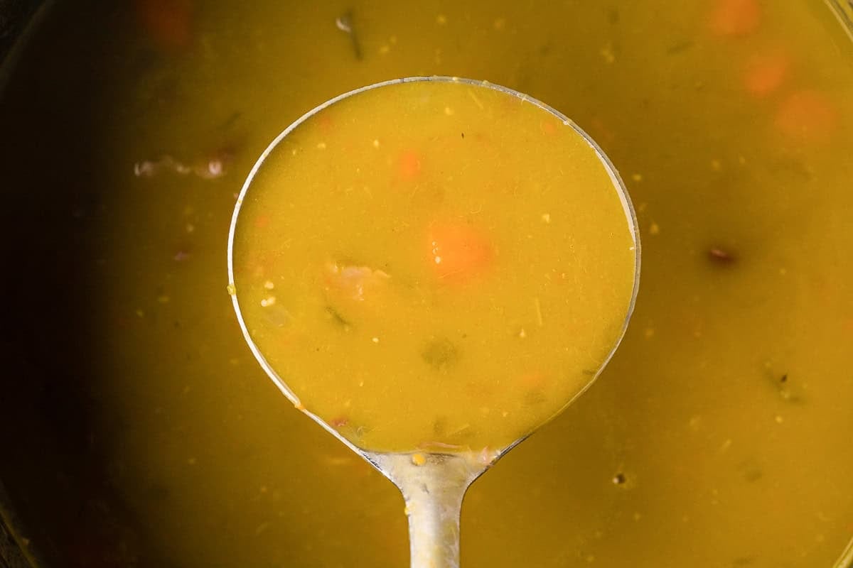 ladle of split pea soup.