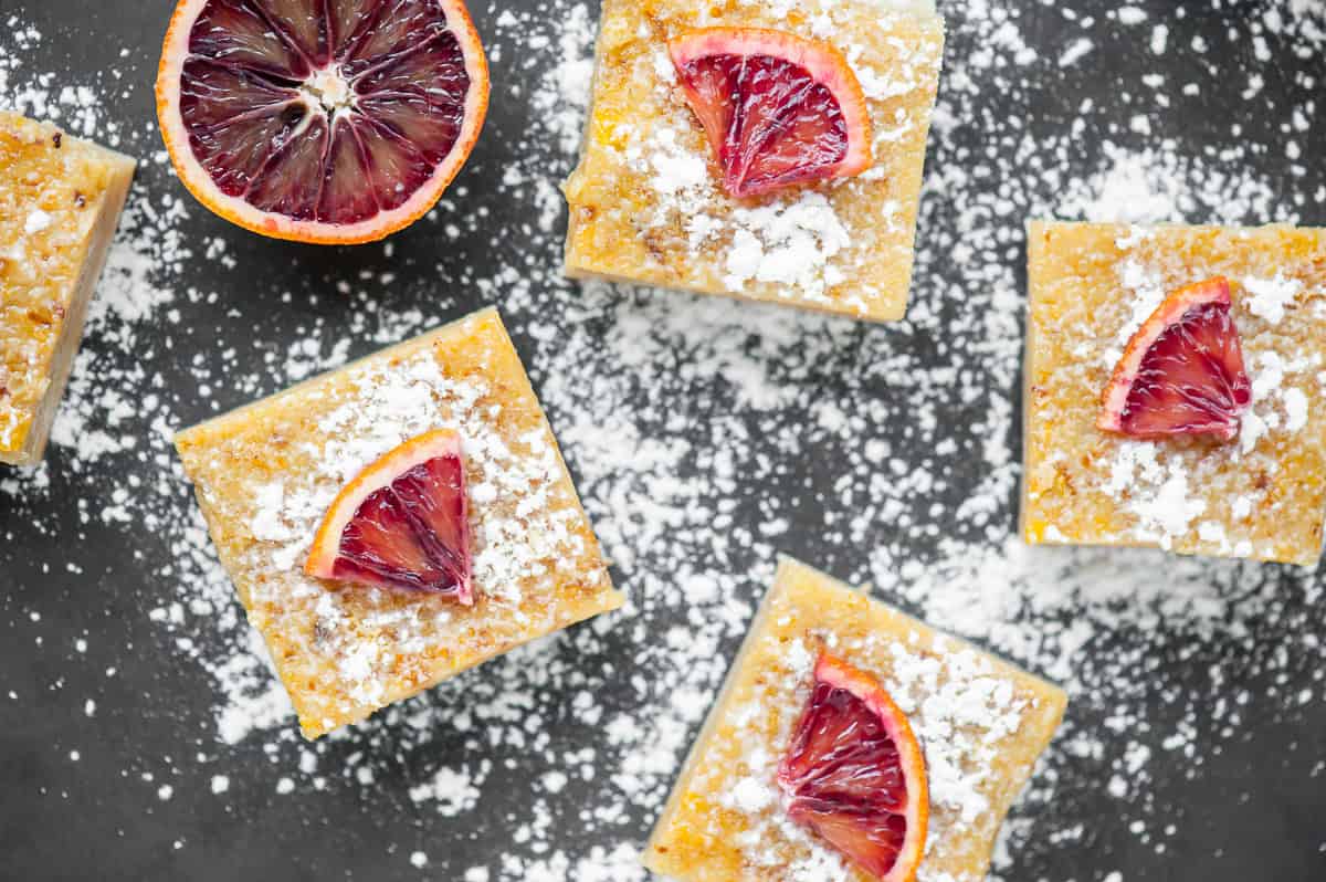 top view of homemade Orange bars dusted with powdered sugar.