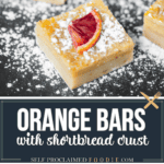 Orange bars dusted with powdered sugar.