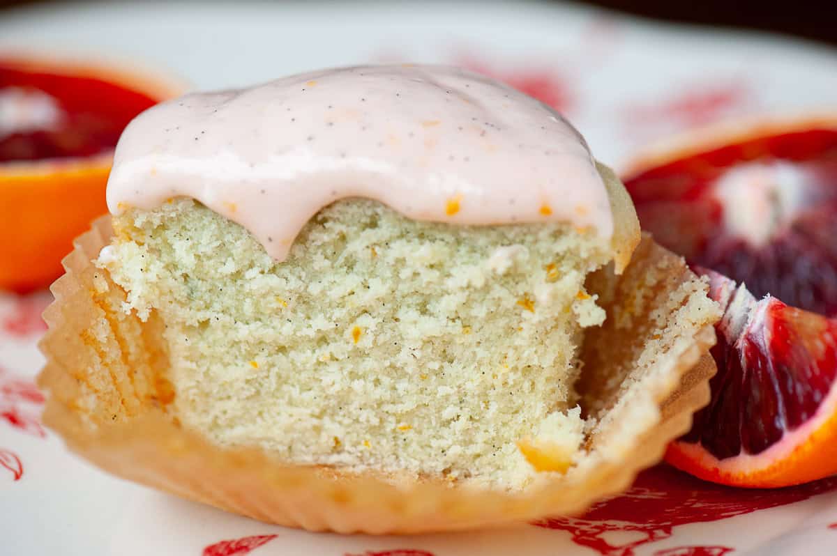 orange cupcake with orange vanilla frosting.