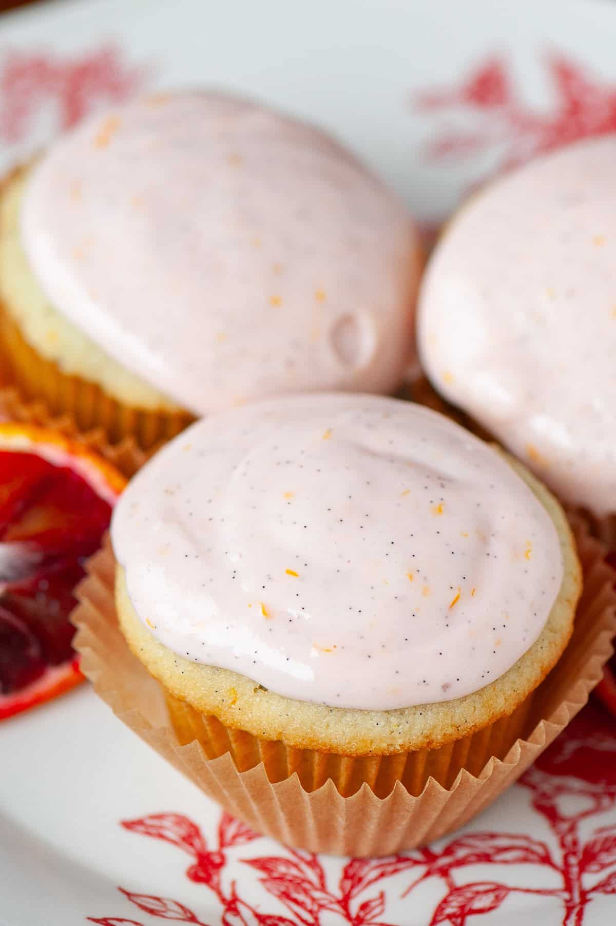 orange cupcake with orange vanilla frosting.