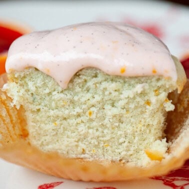 orange cupcake with orange vanilla frosting.