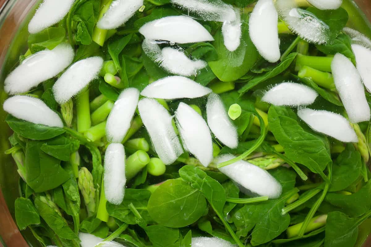 spring vegetables in ice bath.